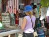 charlottecheckingouttherowsandrowsoftrinketsandsouvenirsatthemarketnearthedock_small.jpg