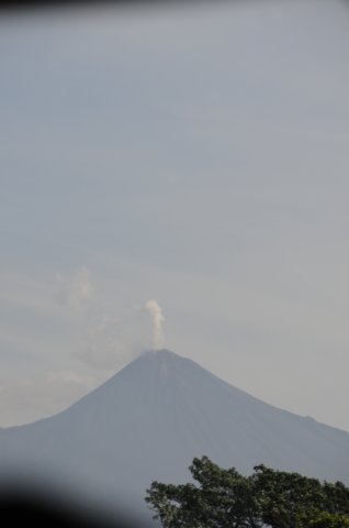 smokingvolcanoasseenfromourtourbuswindow.jpg